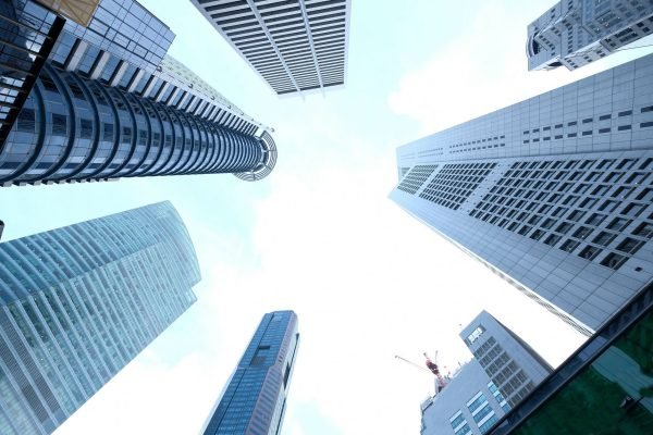 A striking upward view of various skyscrapers in an urban setting against a clear sky. — Best Seafood Restaurants in Madrid