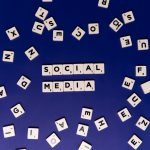 Scrabble tiles spelling 'Social Media' on a blue background, ideal for digital marketing themes. — Why White Label Facebook A