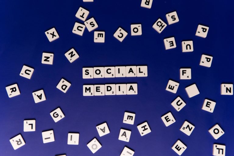 Scrabble tiles spelling 'Social Media' on a blue background, ideal for digital marketing themes. — Why White Label Facebook A
